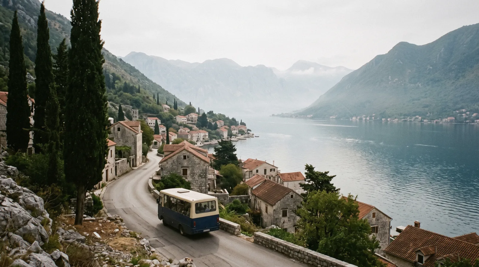View over Kotor old town rooftops toward the bus station and the bay