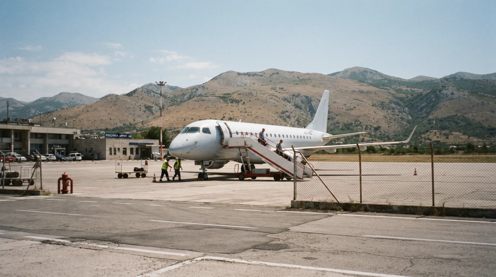 Road sign and highway on the route from Podgorica airport toward the Bay of Kotor