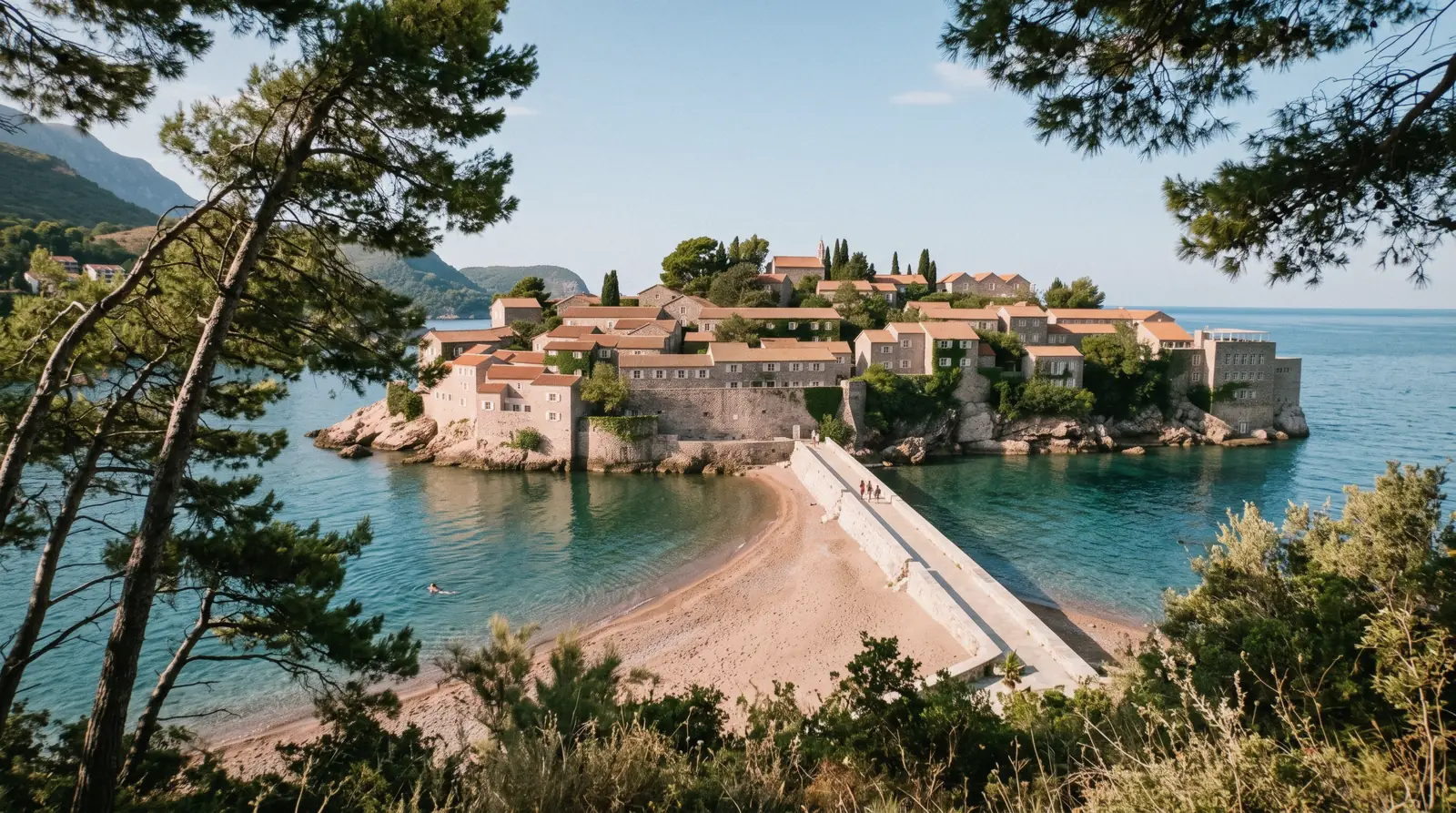 The fortified islet of Sveti Stefan joined to the Montenegrin coast by a sandy isthmus